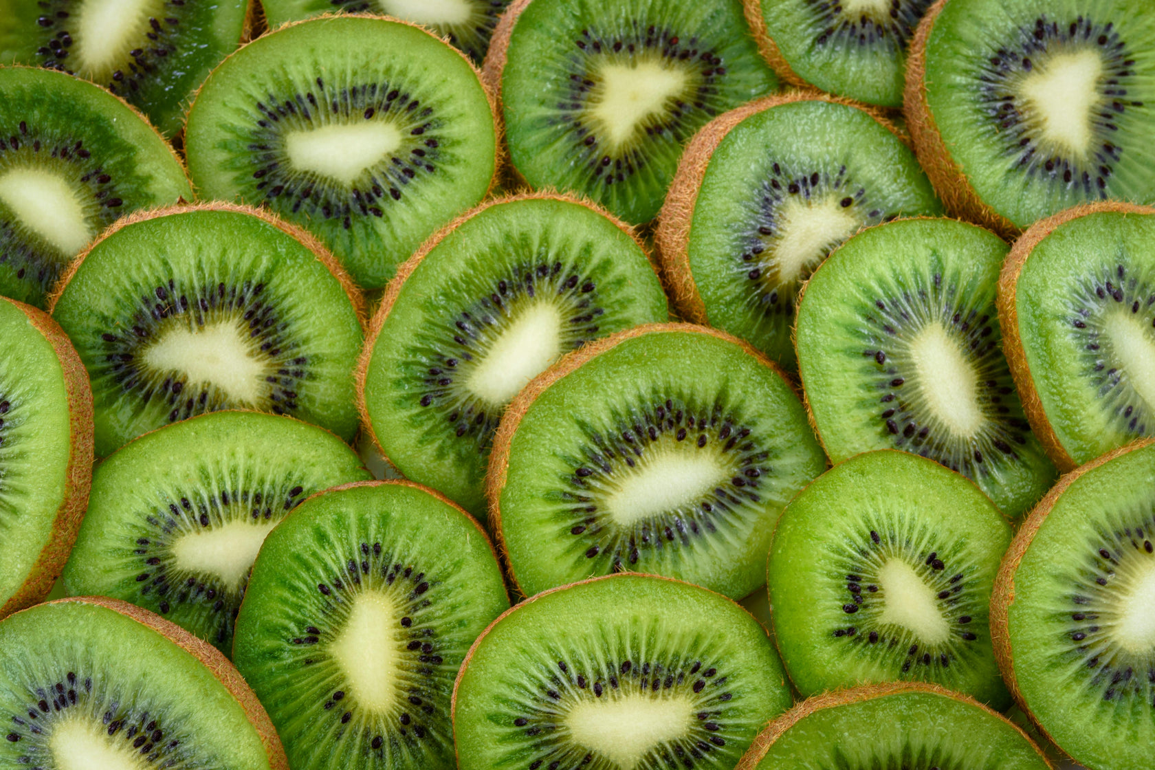 Close-up of sliced kiwis arranged in a pattern