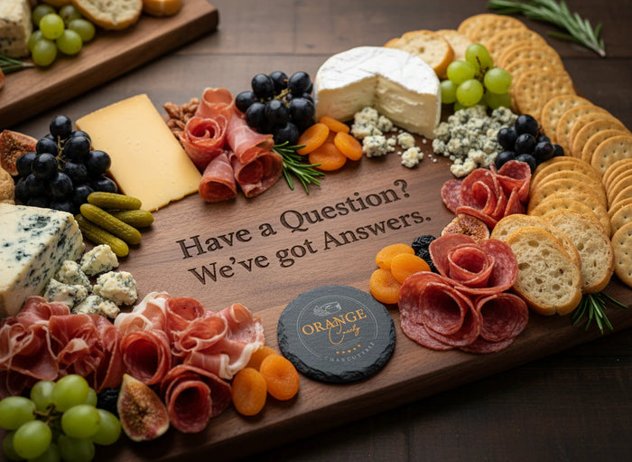 Wooden charcuterie board with various meats, cheeses, and fruits on a wooden surface.
